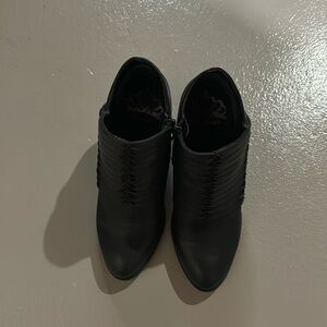 Black Booties with zipper on side, very cute details on front. Super comfy
